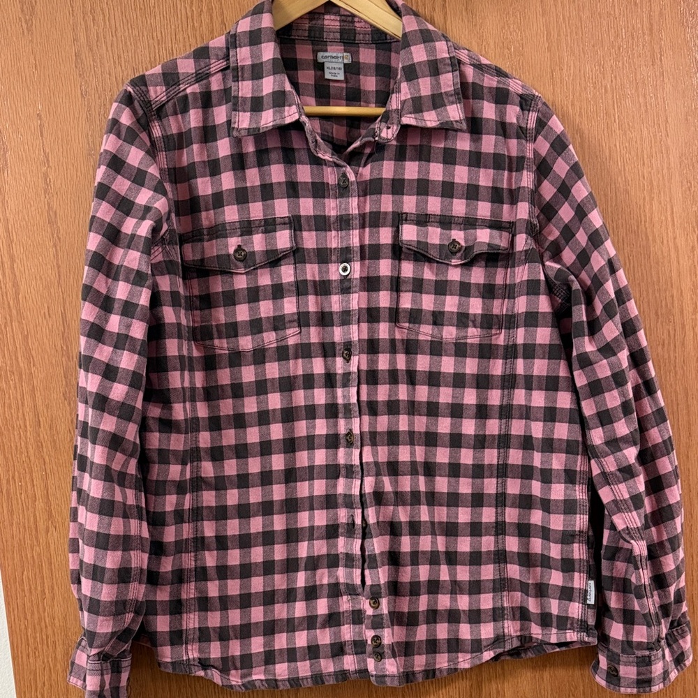 Carharrt women’s pink and black flannel shirt.
